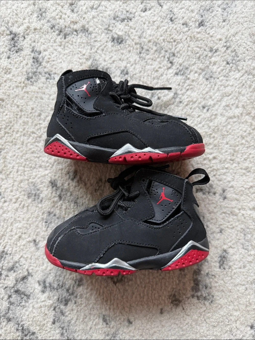 Jordan Kids size 7C shoes. Shows signs of wear.